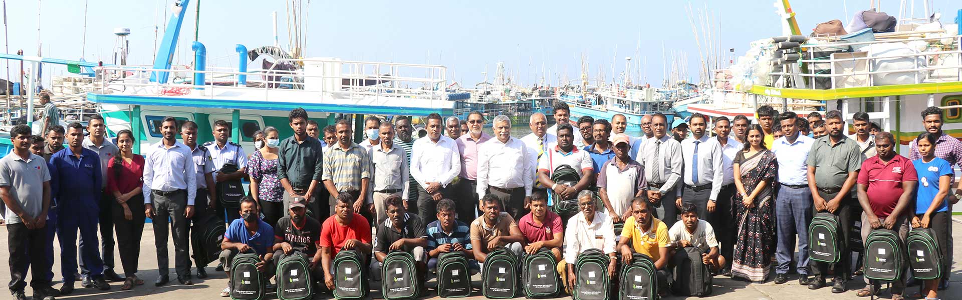 Representatives of DIMO and Dikkowita Fishery Harbour with parents of the children at the book distribution held in Dikkowita